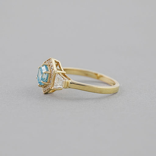 side view of blue hexagon-cut lab diamond halo 3-stone colored engagement ring