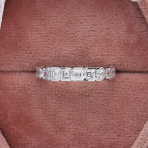 Asscher Cut Lab Diamond Half Eternity Wedding Band displayed in a soft pink jewelry box, featuring a row of sparkling Asscher cut diamonds set in a sleek band.