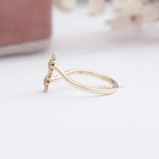 side view of two flower shape tapered baguette cut lab diamond bypass wedding ring