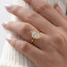 top view of marquise lab diamond bezel set solitaire engagement ring in hand