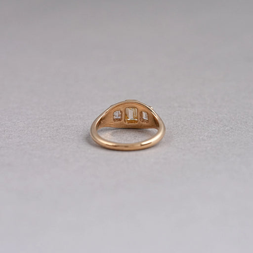 back view of yellow emerald-cut diamond 3 stone bezel set colored engagement ring