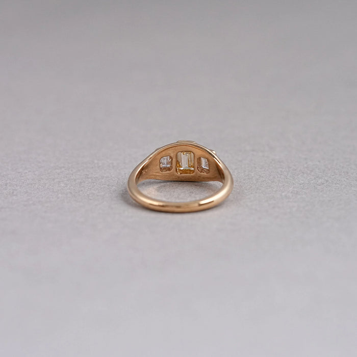 back view of yellow emerald-cut diamond 3 stone bezel set colored engagement ring