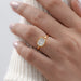 east west cushion cut bezel set diamond engagement ring on women hand