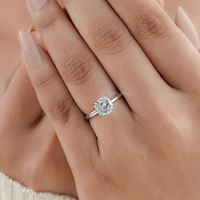 igi certified cushion cut lab diamond engagement ring on model's hand