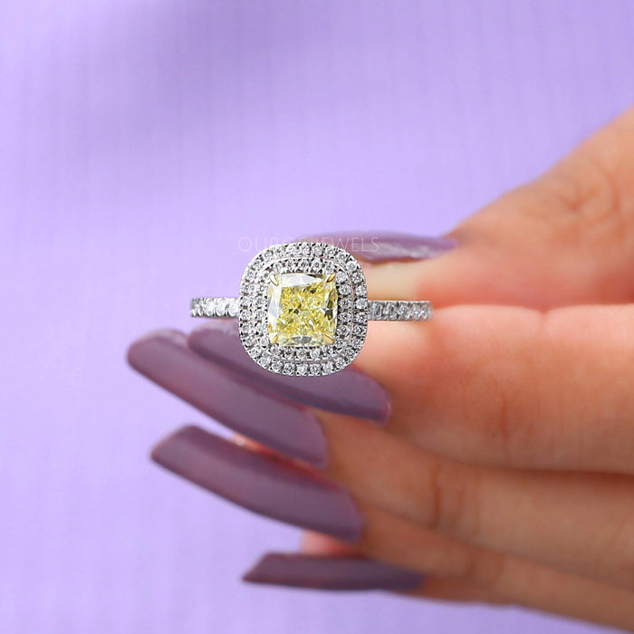 close view of yellow cushion cut lab diamond double halo engagement ring