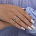 round cut lab made diamond white gold ring with chain link in finger