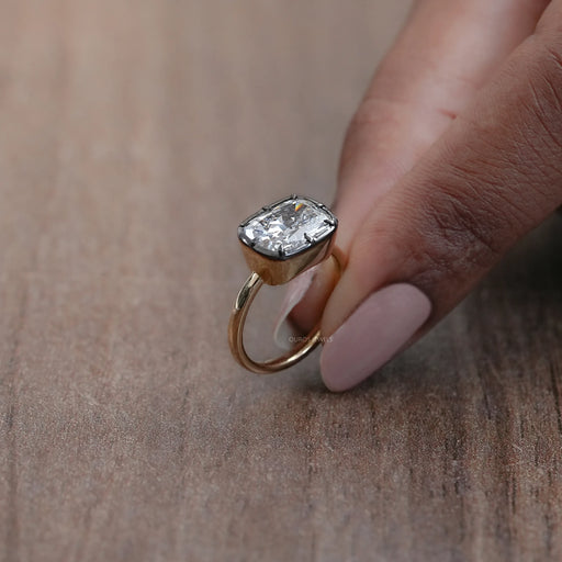 side view of east west cushion diamond black coating solitaire engagement ring