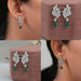 green gemstone and diamond cluster drop earrings