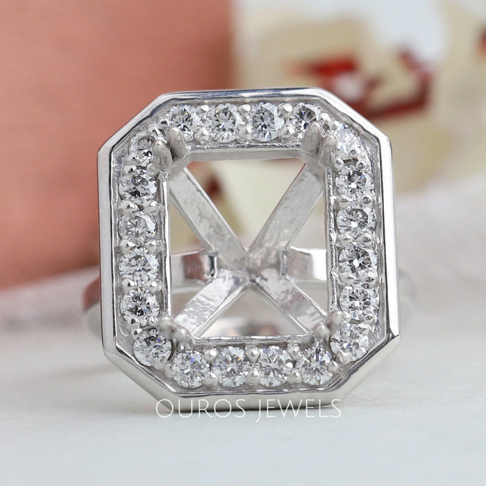 front view of emerald cut round diamond halo semi-mount engagement ring