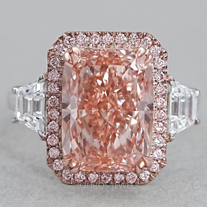 front view of pink cushion-cut lab diamond halo 3 stone colored engagement ring