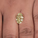 Fancy Yellow Intense Oval Cut DIamond on Hand 