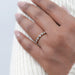 five stone round cut lab diamond bezel set engagement ring on model's finger