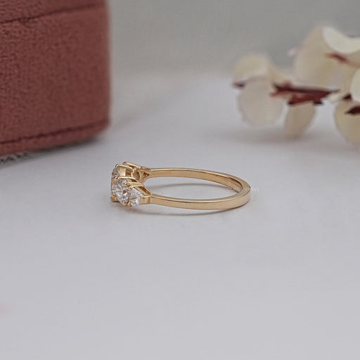 side view of round and shield cut lab diamond five stone engagement ring