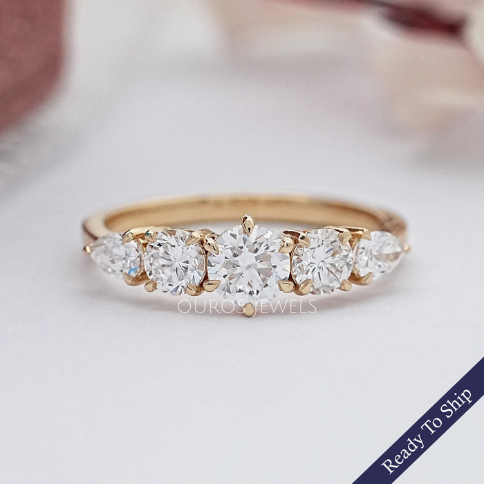 front view of round and pear cut lab diamond five stone engagement ring