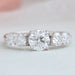 front view of round-cut diamond bezel-set curved wedding band with white gold band