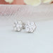 side view of floral round halo diamond screw back stud earrings white gold