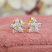 front view of marquise cut lab grown diamond flower stud earrings yellow gold