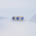 Image of gorgeous three stone oval sapphire halo ring