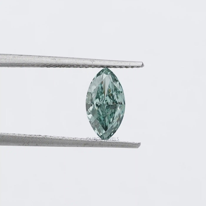 1.23 Carat Green Marquise Cut Loose Diamond held by silver tweezers