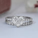front view of square radiant-cut diamond solitaire bridal ring set on grey fabric