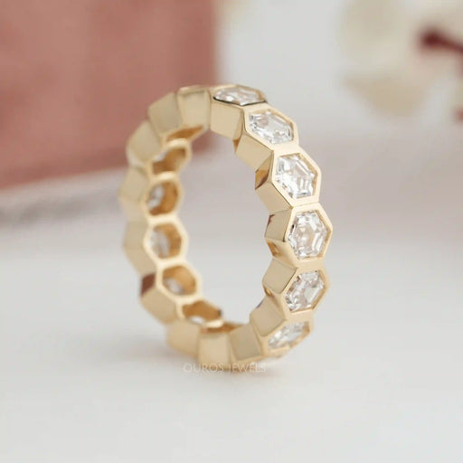 side view of hexagon cut man made diamond full gold eternity wedding band