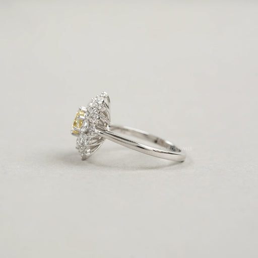 side view of fancy yellow cushion cut diamond with heart & pear sunburst halo ring