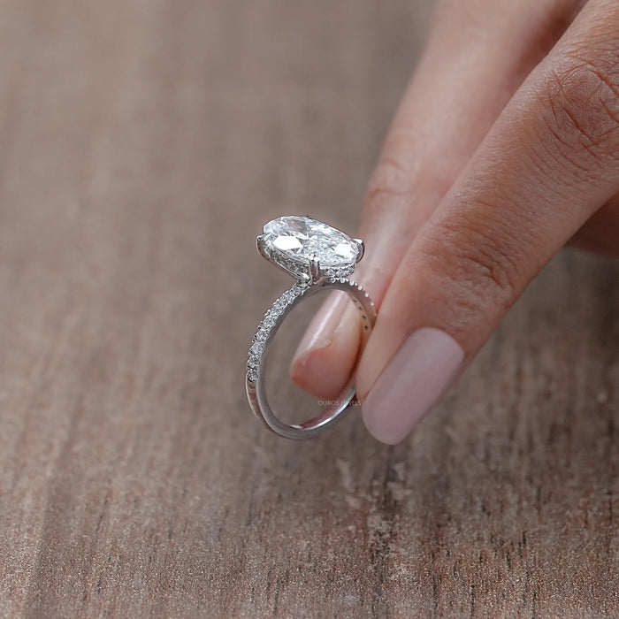 side view of oval-cut lab-grown diamond solitaire accent engagement ring