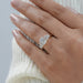 radiant and baguette cut lab diamond five stone engagement ring on model's finger