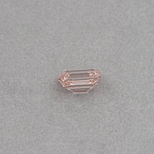 side view of 10 carat loose pink emerald cut lab created diamond