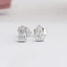 A close-up view of Arrow Cut Stud Diamond Earrings, each featuring a brilliant arrow-shaped diamond 