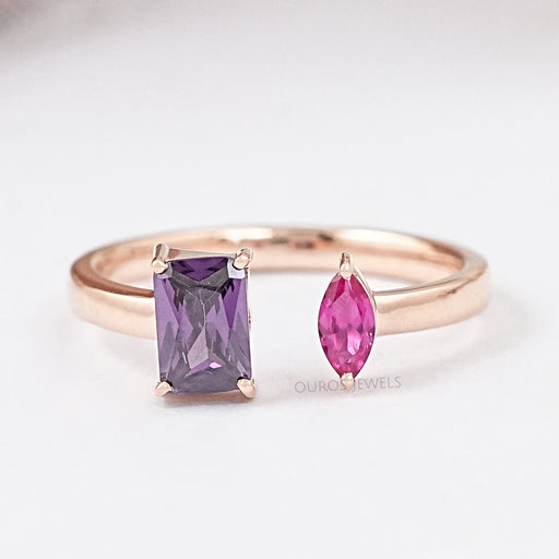 front view of emerald and marquise-cut gemstone toi et moi wedding ring