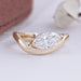 front view of marquise cut lab diamond wave engagement ring in yellow gold