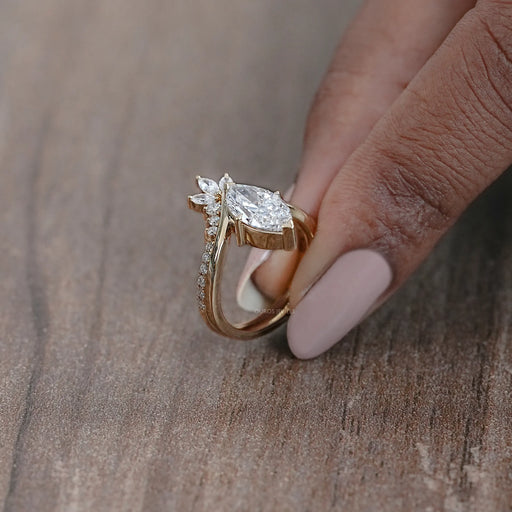 side view of marquise-cut lab diamond wedding ring set with yellow gold band