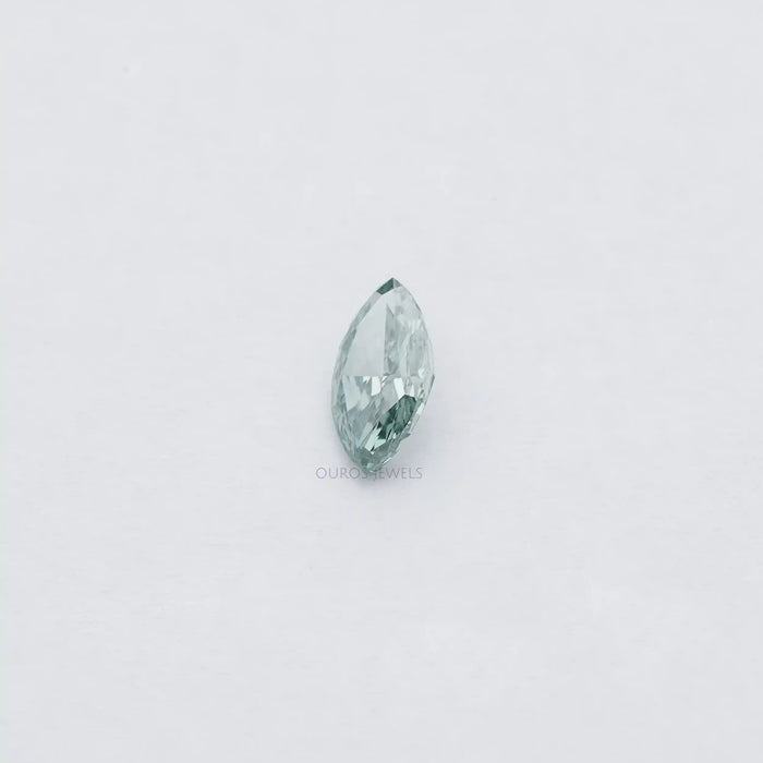 1.23 Carat Green Marquise Cut Loose Diamond showing with soft white background.