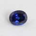 front view of blue sapphire oval cut lab grown gemstone on fabric