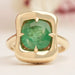 front view of cushion-cut gemstone emerald-shaped band solitaire engagement ring