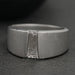 front view of tapered baguette cut diamond solitaire men's wedding ring