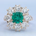 front view of emerald square green cushion gemstone round halo floral engagement ring