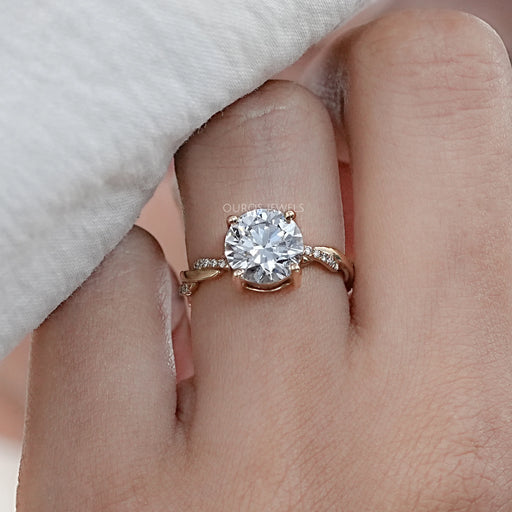 front view of twisted round-cut lab diamond solitaire accent anniversary ring