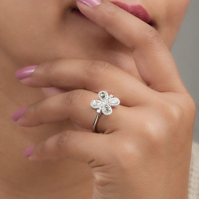 Einzigartiger floraler Ring mit Oliven- und Birnenschliff und Halo-Lab-Diamant