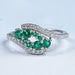 front view of green round gemstone cluster bypass engagement ring