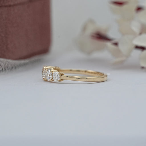 side view of cushion and round cut lab diamond five stone engagement ring