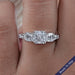 front view of asscher cut diamond five stone engagement ring with white gold band