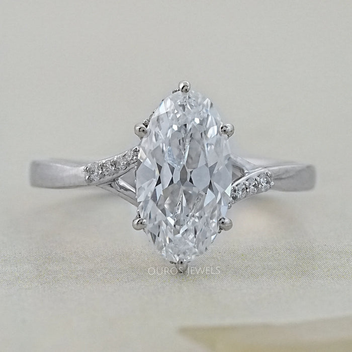 front view of old mine moval cut lab diamond split shank wedding ring on grey fabric