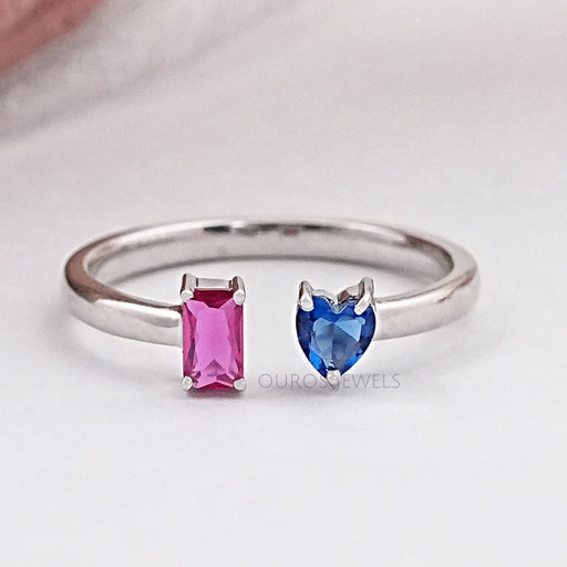 front view of pink emerald and blue heart gemstone open wedding band