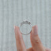 close view of oval and trillion cut lab diamond five stone engagement ring