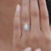 pear cut lab diamond halo eternity wedding ring in finger
