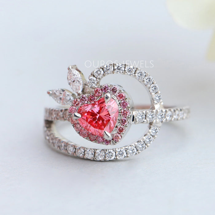 front view of pink heart-cut lab-grown diamond halo wedding ring