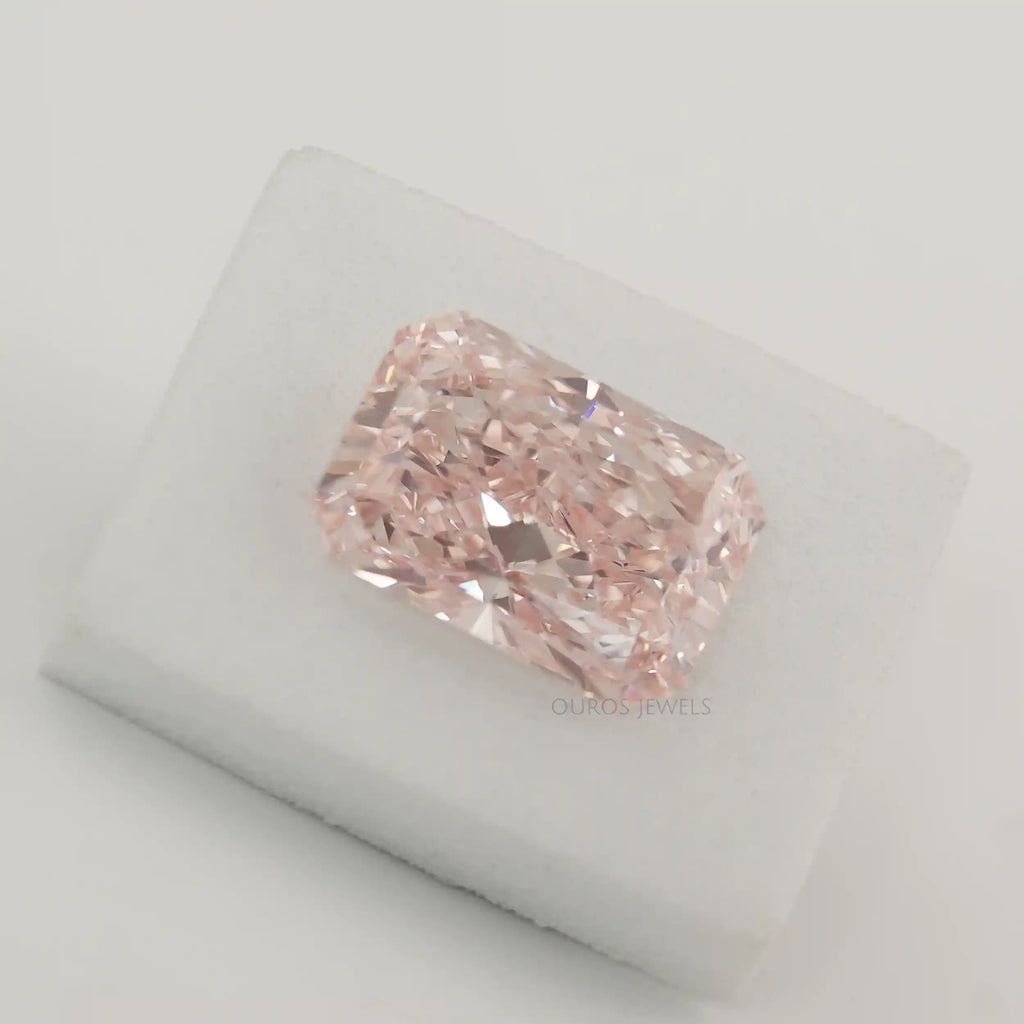 Pink Radiant Cut Loose Diamond on White Surface 