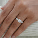 princess cut diamond five stone engagement ring in yellow gold band in finger